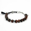 Packshot face sur fond blanc bracelet en perles d'œil de taureau Thaïs